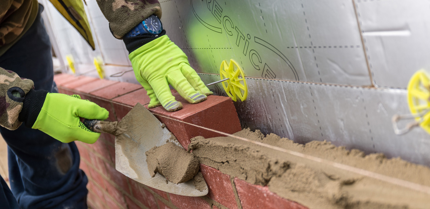 Bricks being laid by Recticel Insulation's Eurowall + in Foreman Homes project image