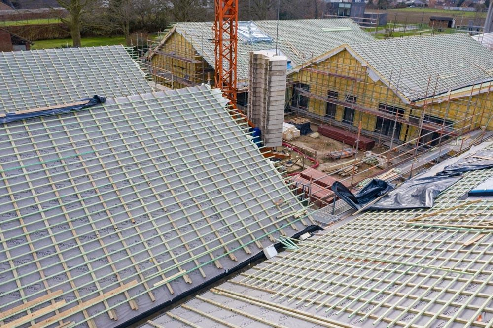 Nieuwbouw project vzw Ubuntu geïsoleerd met Powerroof Max hellend dak isolatie