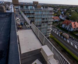 Recticel Insulation's Deck-VQ VIP insulation panel laid on a flat roof application image high wide angle shot