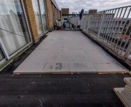 Recticel Insulation's Deck-VQ VIP insulation panel laid on a flat roof application image